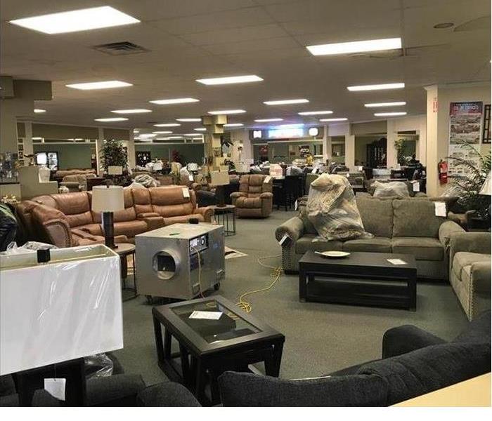A furniture store with SERVPRO machines after a water damage event
